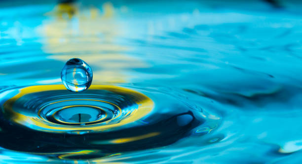 istock water drop in a glass of water 905152042