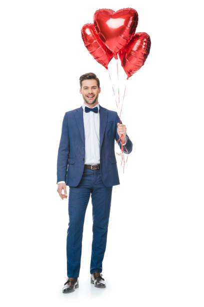 istock happy young man with heart shaped balloons 905154688