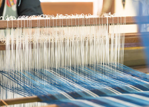 istock Weave silk cotton on the manual wood loom 905155100