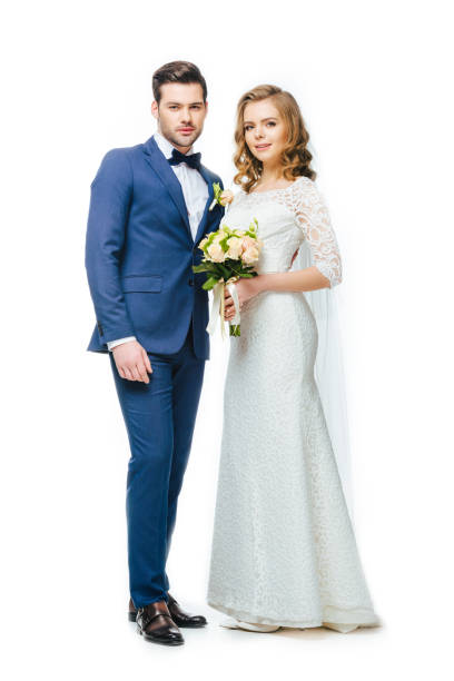 istock young wedding couple looking at camera isolated on white 905160356