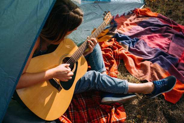 istock Tourist girl playing guitar concept. 905162990