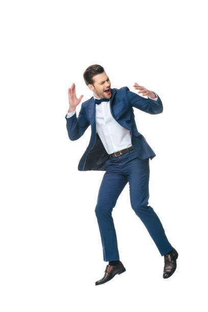 istock excited man in suit jumping isolated on white 905163770