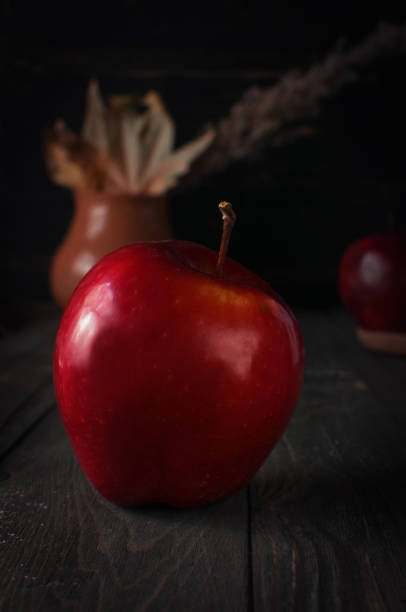 istock Autumn time. Still-life with a red apple 905164122