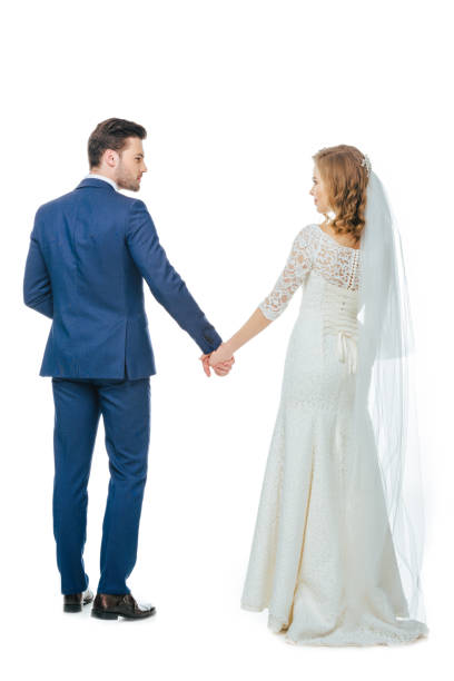 istock back view of beautiful wedding couple holding hands 905167460