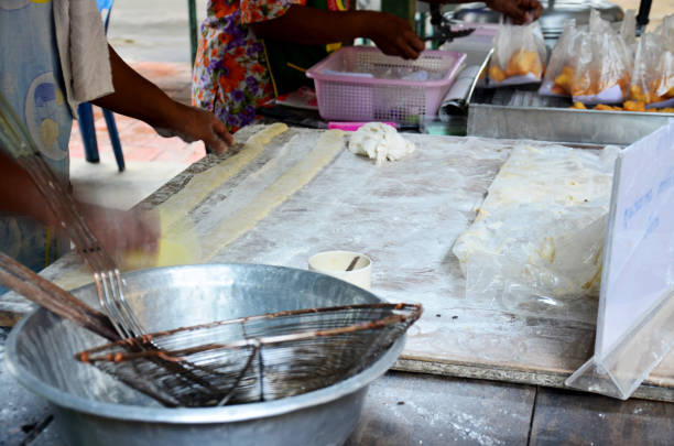 istock Thai people cooking deep-fried doughstick or Youtiao 905168572
