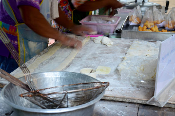 istock Thai people cooking deep-fried doughstick or Youtiao 905168590