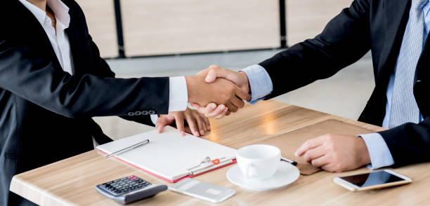 istock handshake for business and teamwork for achievement KPI and goal 905176636