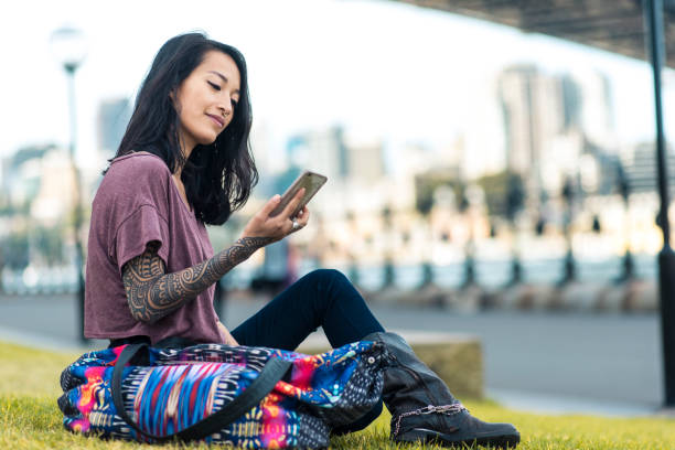 istock Asian woman relaxing and using smart phone in Sydney 905177132