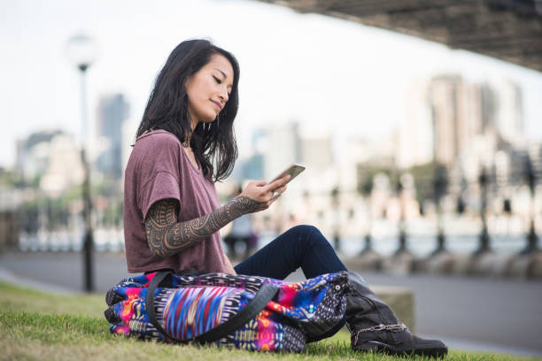 istock Asian woman relaxing and using smart phone in Sydney 905177158