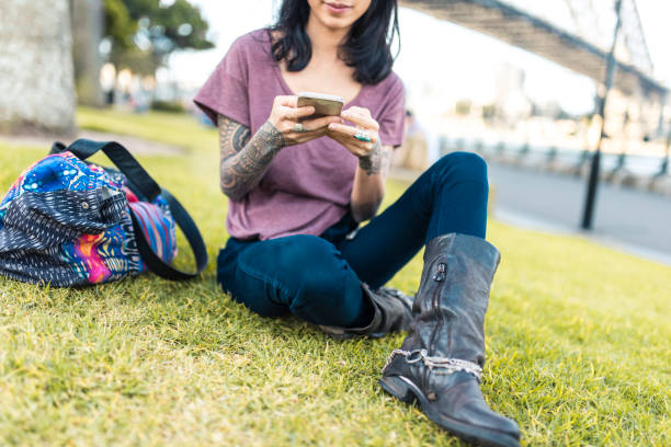istock Asian woman relaxing and using smart phone in Sydney 905177178