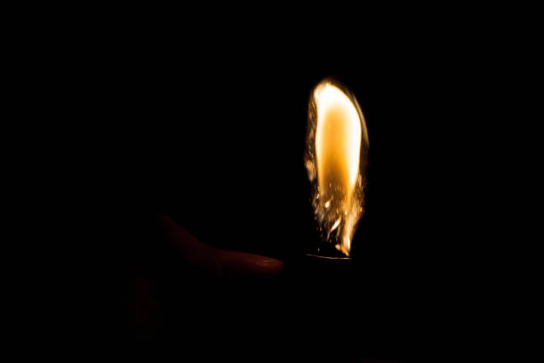 The match lights the candle, it looks like the flame is also burning