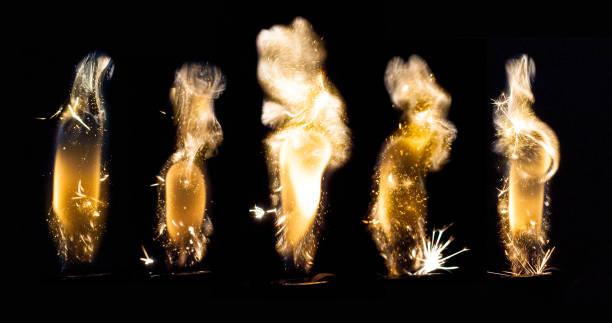 istock Close up view of real sparking light from lighter in dark black background 905179874