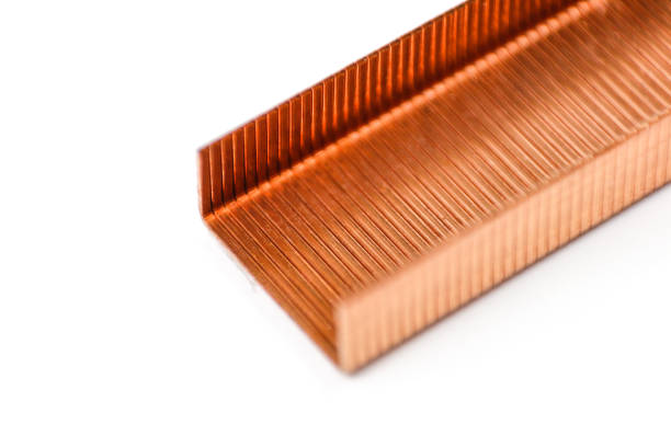 Gold staples for stapler on a white background. Closeup