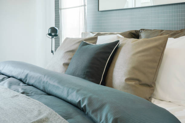 istock Close up pillows on bed in modern interior bedroom 905189078