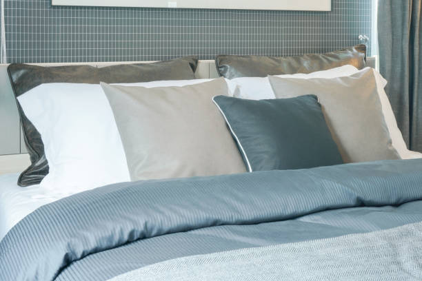 istock Close up pillows on bed in modern interior bedroom 905190384