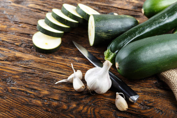 istock Whole and chopped zucchini on the kitchen table 905192516