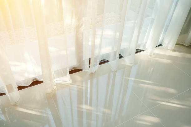 istock Beautiful morning light through sheer curtain in bedroom 905193676