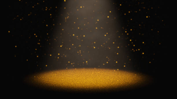 мерцающий золотой блеск, падающий через конус света на сцене - oval shape фотографии стоковые фото и изображения