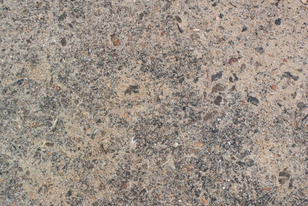 istock Stucco grungy wall texture closeup 905204390