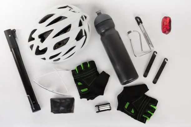 Photo of Bike accessories, bike helmet, bike gloves, eyeglasses, bottle in holder