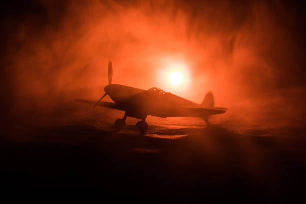 istock British jet-propelled model plane in possession. Dark orange fire background. War scene. 905213800