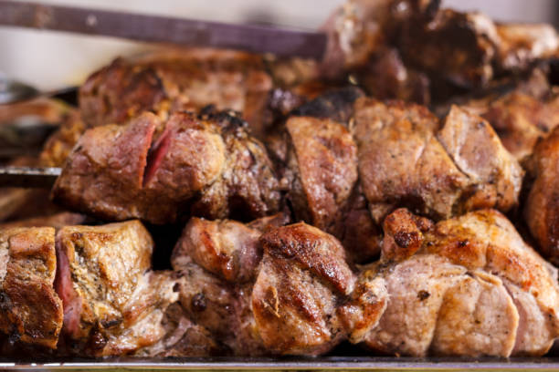 istock Fresh, hot, fried, appetizing shish kebab cooked on the grill on the coals. 905217262