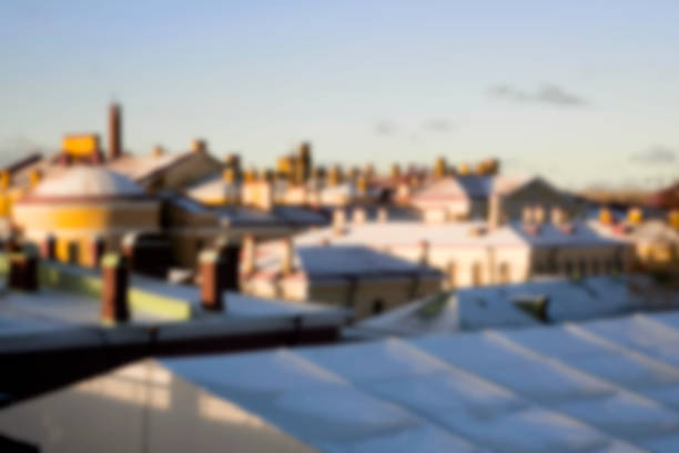 Blurred and abstract view of the roofs in the city of St. Petersburg from the observation platform of the Peter and Paul Fortress in winter.