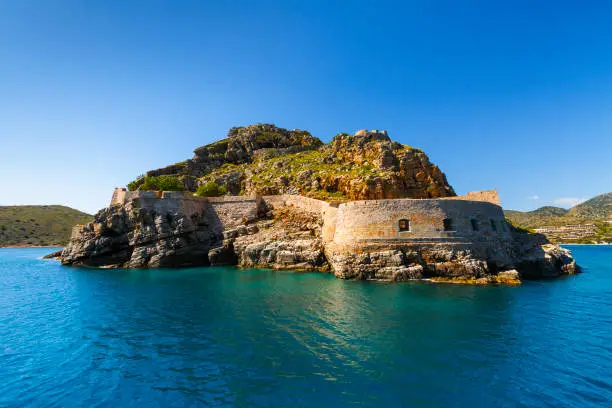 Historical site of Spinalonga island on a sunny spring day, Crete, Greece.