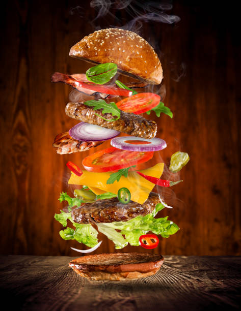 istock Big tasty burger with flying ingredients 905231434