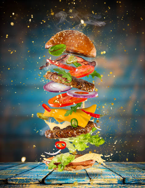 istock Big tasty burger with flying ingredients 905231520