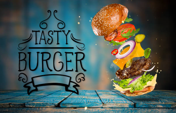 Big tasty burger with flying ingredients