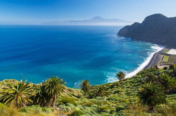 View of Santa Catalina beach and mountains with Tenerife island in the background, La Gomera island, Spain View of Santa Catalina beach and mountains with Tenerife island in the background, La Gomera island, Spain agulo stock pictures, royalty-free photos & images