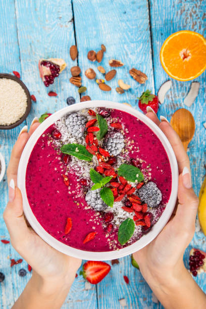 istock Smoothie bowl with fresh berries, nuts, seeds, fruit and vegetables 905234518