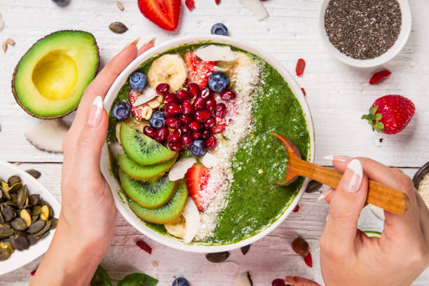 istock Smoothie bowl with fresh berries, nuts, seeds, fruit and vegetables 905234546