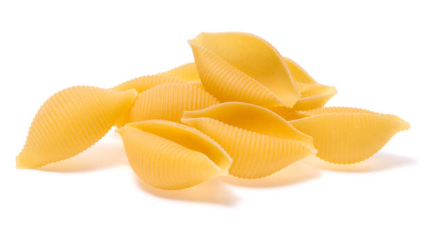 istock Uncooked Italian pasta isolated on white background 905234926