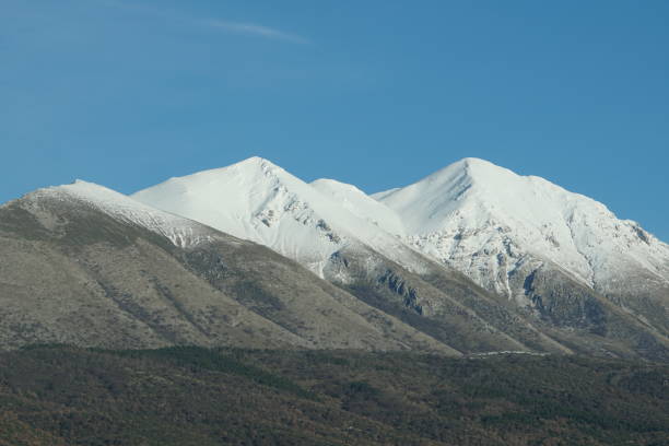 istock Snowy peaks against blue sky 905238364