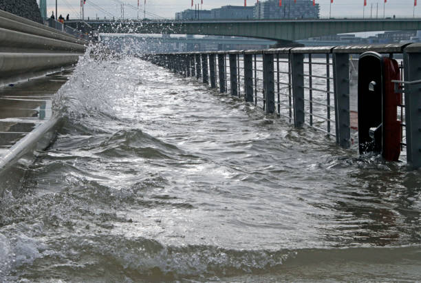 The rising rhein river flooding pedestrian walkways in Cologne, Germany