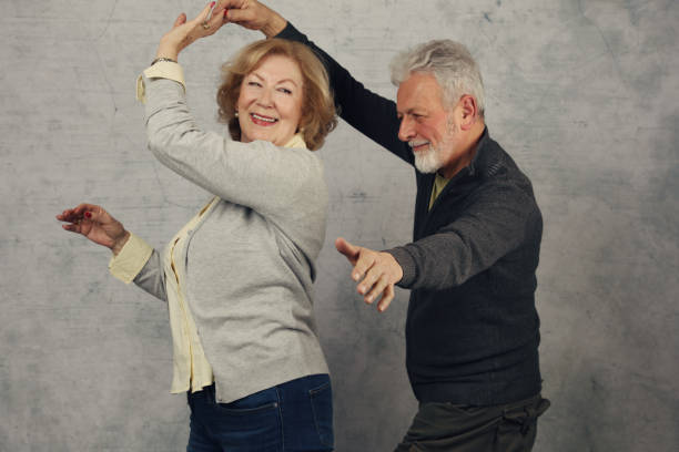 istock Happy stylish elderly couple dancing and laughing. Vintage image 905246254