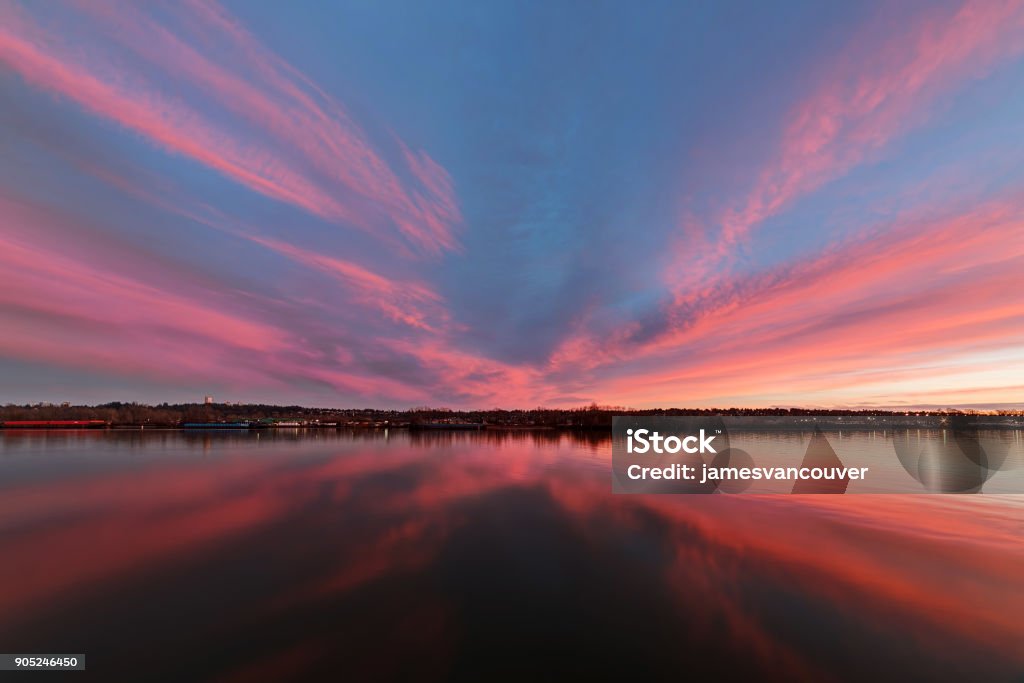 sunset glow over river and riversides Apartment Stock Photo