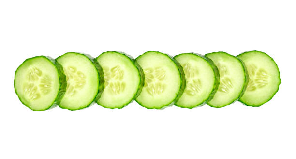 istock Fresh cucumber slices isolated on white background 905251760