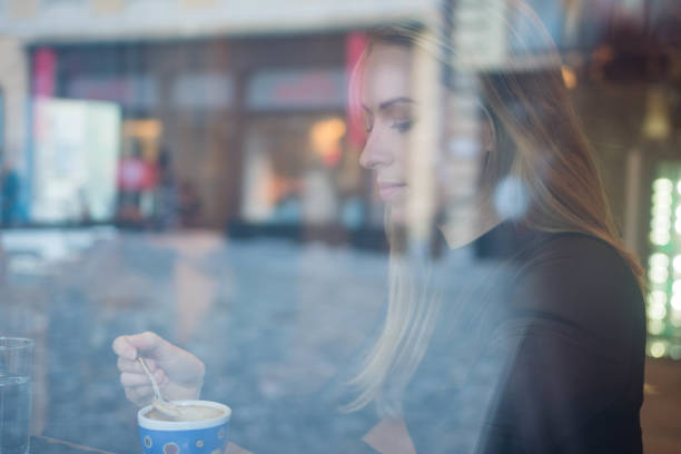 istock Woman having a coffee in a cafe 905279984