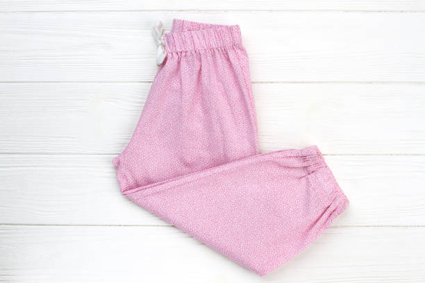 Pink pants on wooden background