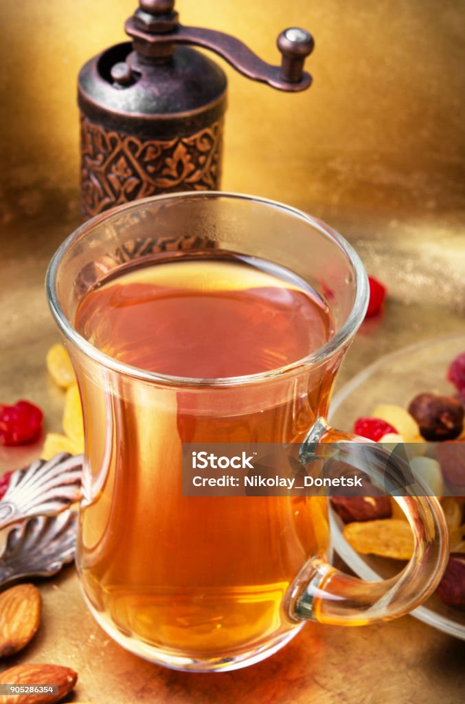 Tea in arab style turk tea with nuts and oriental sweets.Tea still life Almond Stock Photo