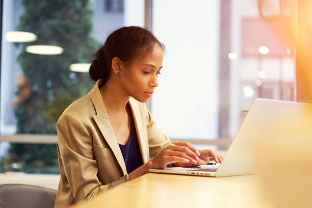 istock Concentrate female editor reading articles on web page of modern online magazine using laptop computer and wireless connection to internet in office copy space area for your advertising content or text 905286408