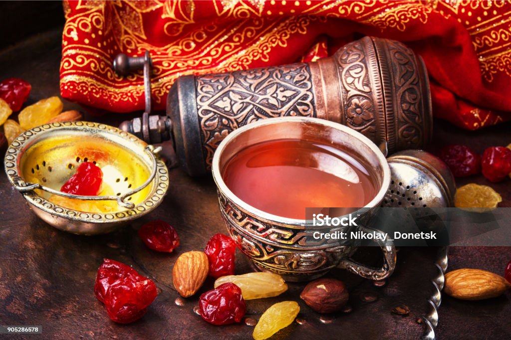 Tea in arab style turk tea with nuts and oriental sweets.Tea still life Islam Stock Photo