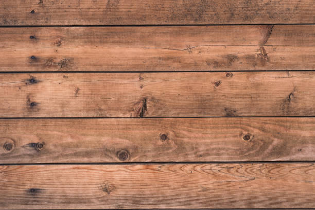 istock wooden rustic background - boards with nail and knots hole 905289192