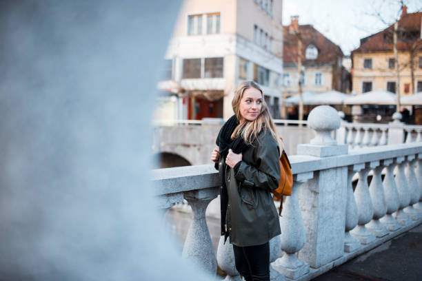 istock Beautiful woman exploring the city 905289606