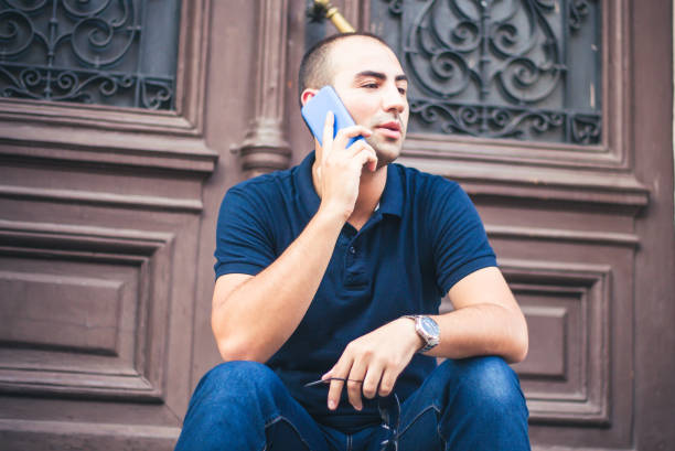 istock Young man talking on mobile phone. 905297150