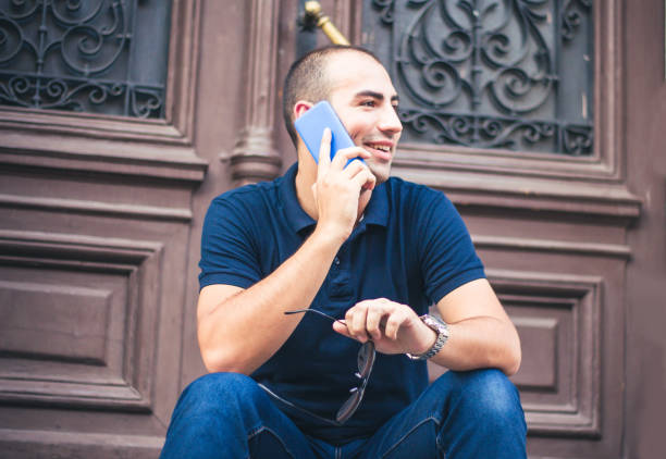 istock Young man talking on mobile phone. 905299240