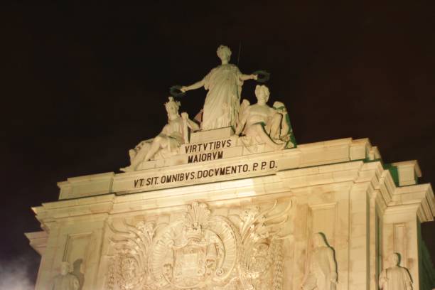 istock Rua Augusta Arch illuminated at night in Lisbon 905300174